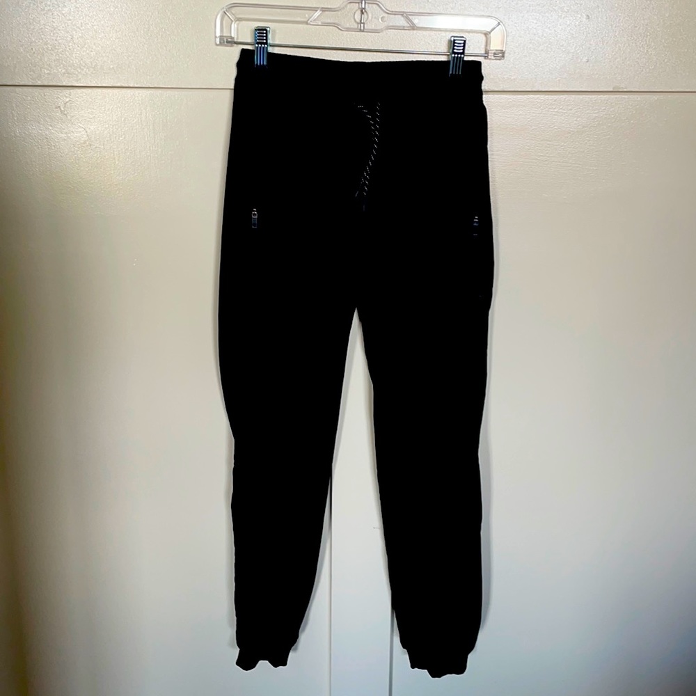 Athleta Girls size 12 Black joggers. Lined. With zipped pockets.